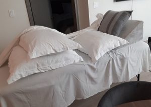 massage table with several pillows